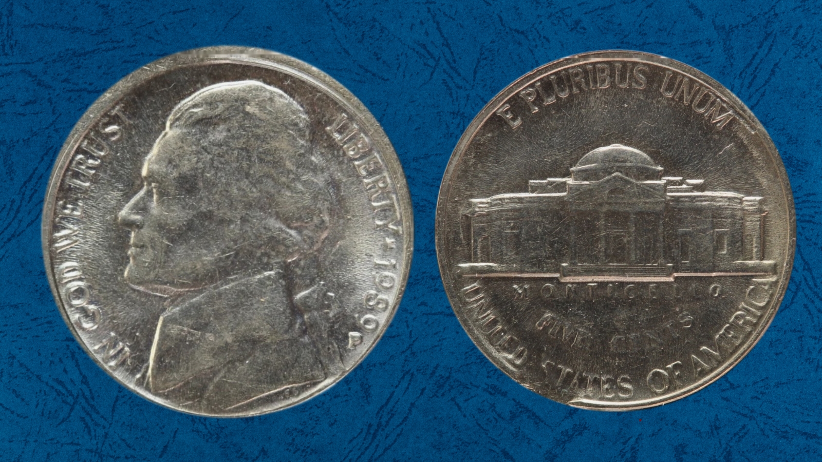 1989 Jefferson nickel broadstrike error showing wider diameter and missing rim compared to normal coin